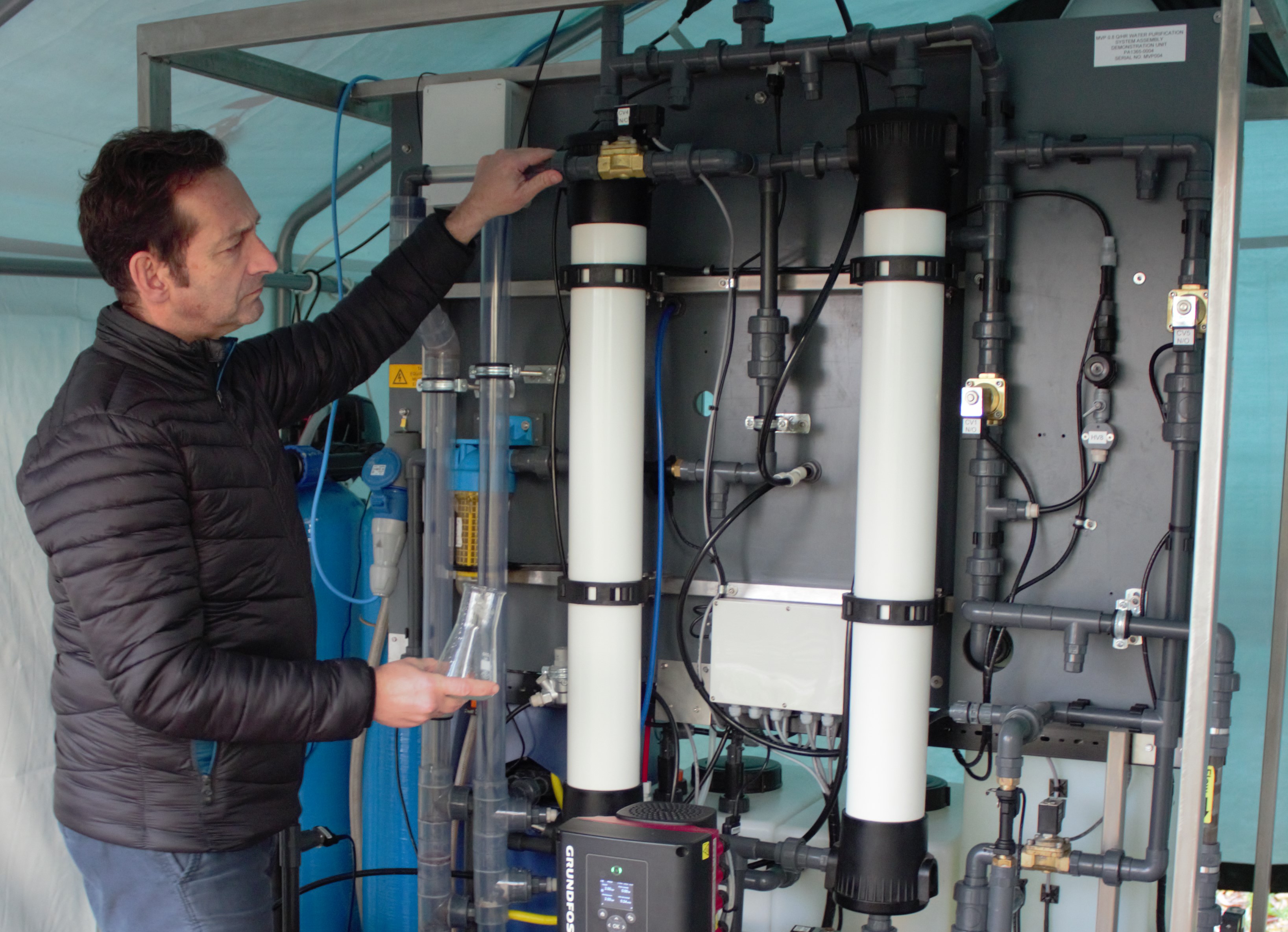 Lead scientist, Professor Darren Reynolds with the portable purification system.