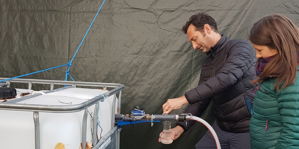 Lead scientist, Professor Darren Reynolds, testing the water with Dr Gillian Clayton.