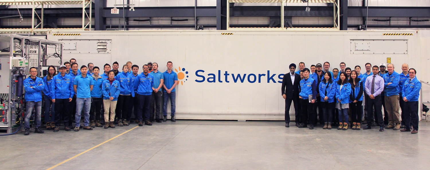 The Saltworks Team and the Honorable Harjit Sajjan in front of the AirBreather plant.