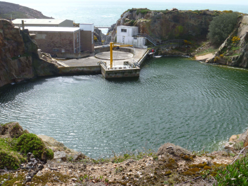 Quarry pool, Jersey, where seawater is stored before treatment.