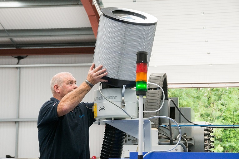 A Filtermist engineer working on a Filtermist oil mist filter.