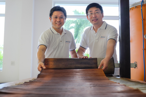 NTU Associate Professor Darren Sun (right) and Managing Director Mr Wong Ann Chai (left) with Nano Sun's 3D printed innovative multiuse membrane.