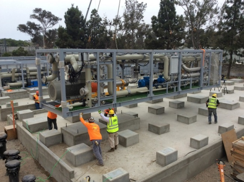 The first skid unit for MPD-A (modular process design) being lifted into position at the Charles E. Meyer Desalination Facility.