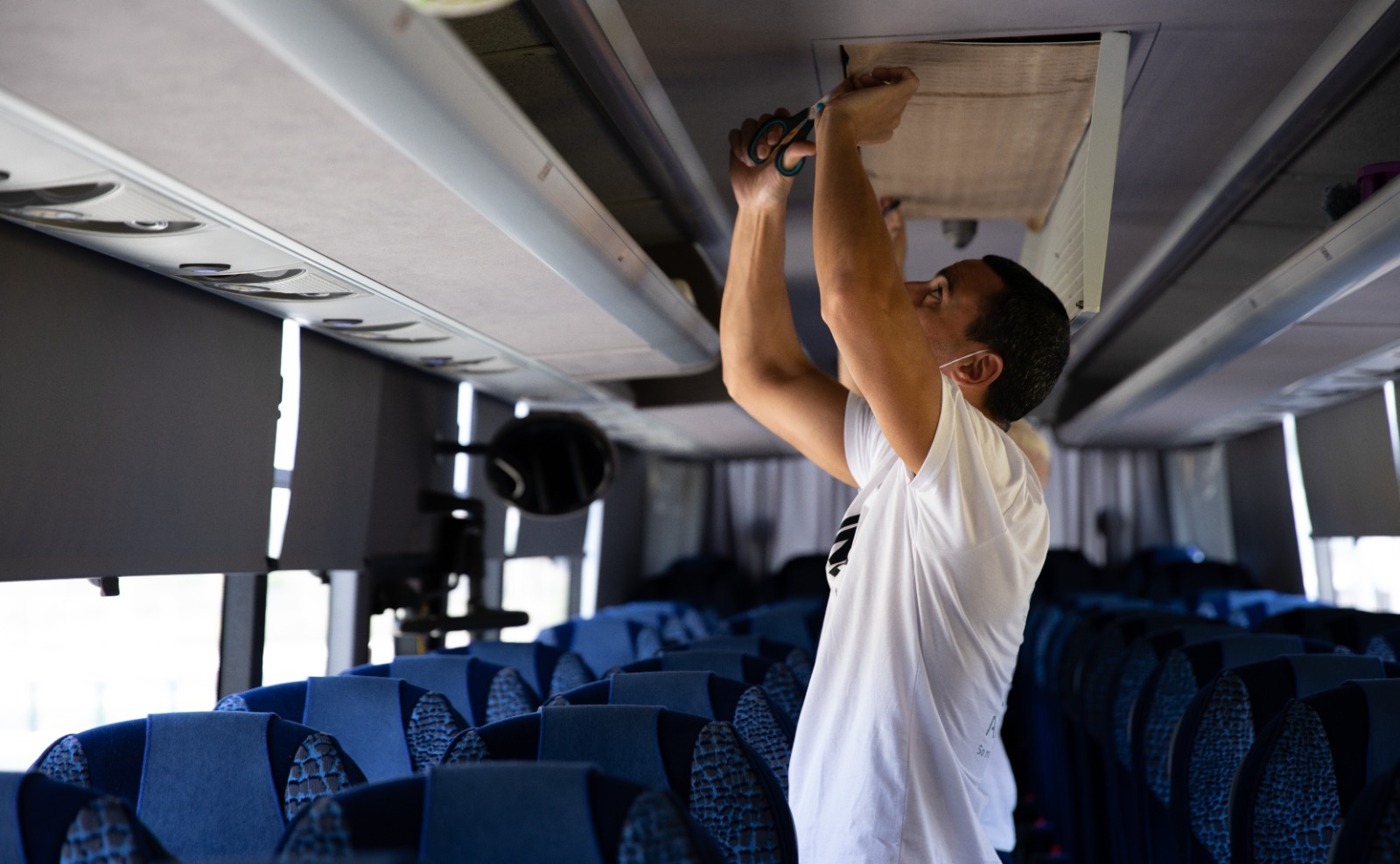 IN-EX, a cabin air filter made from sonochemical coating technology, being installed in a public bus.