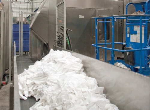 Soiled linens are sorted, laundered, then folded and prepared for distribution to more than 3500 customers.
