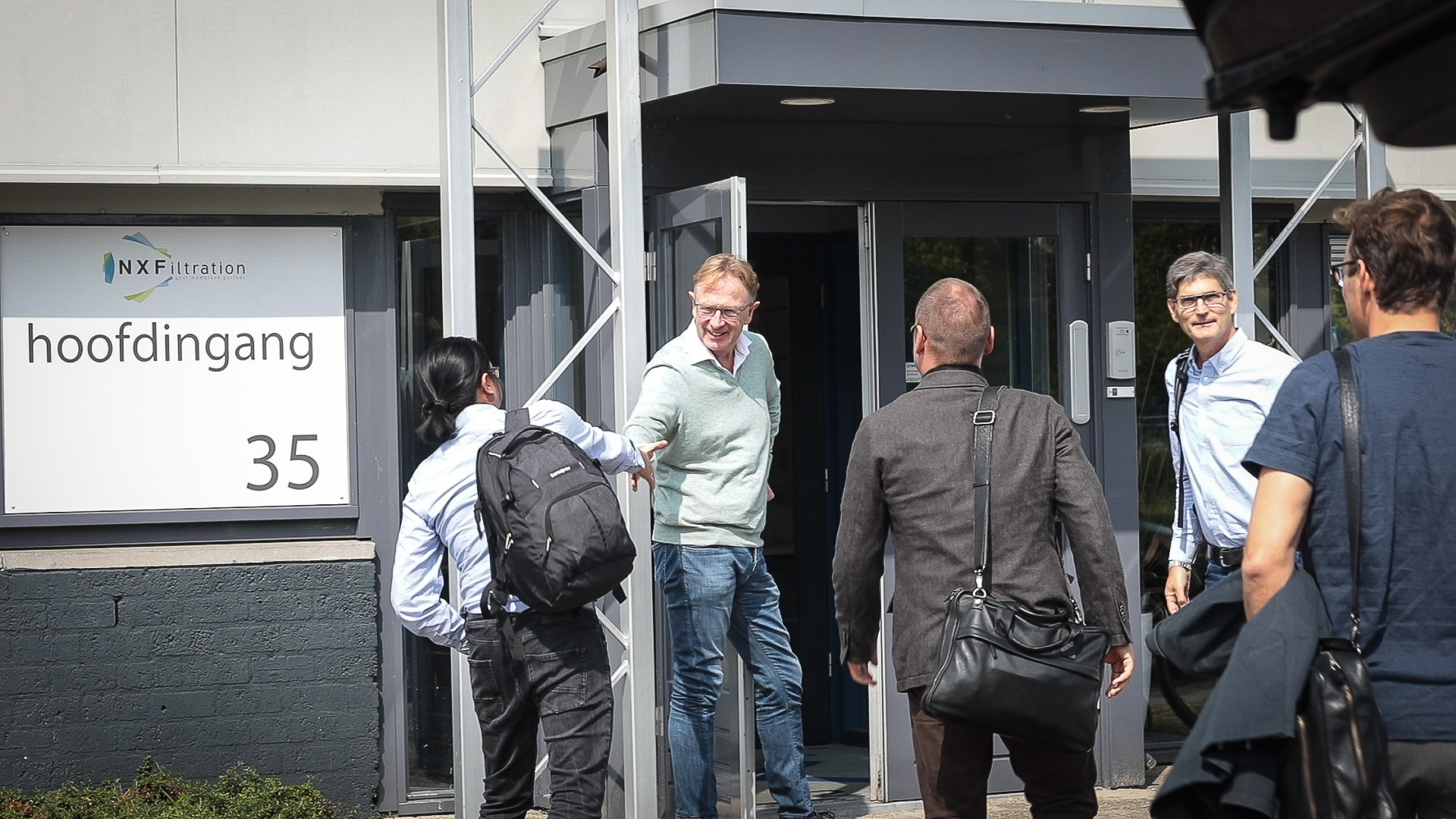 Erik Roesink, general manager at NX Filtration, welcomes representatives from Grundfos and Novozymes.