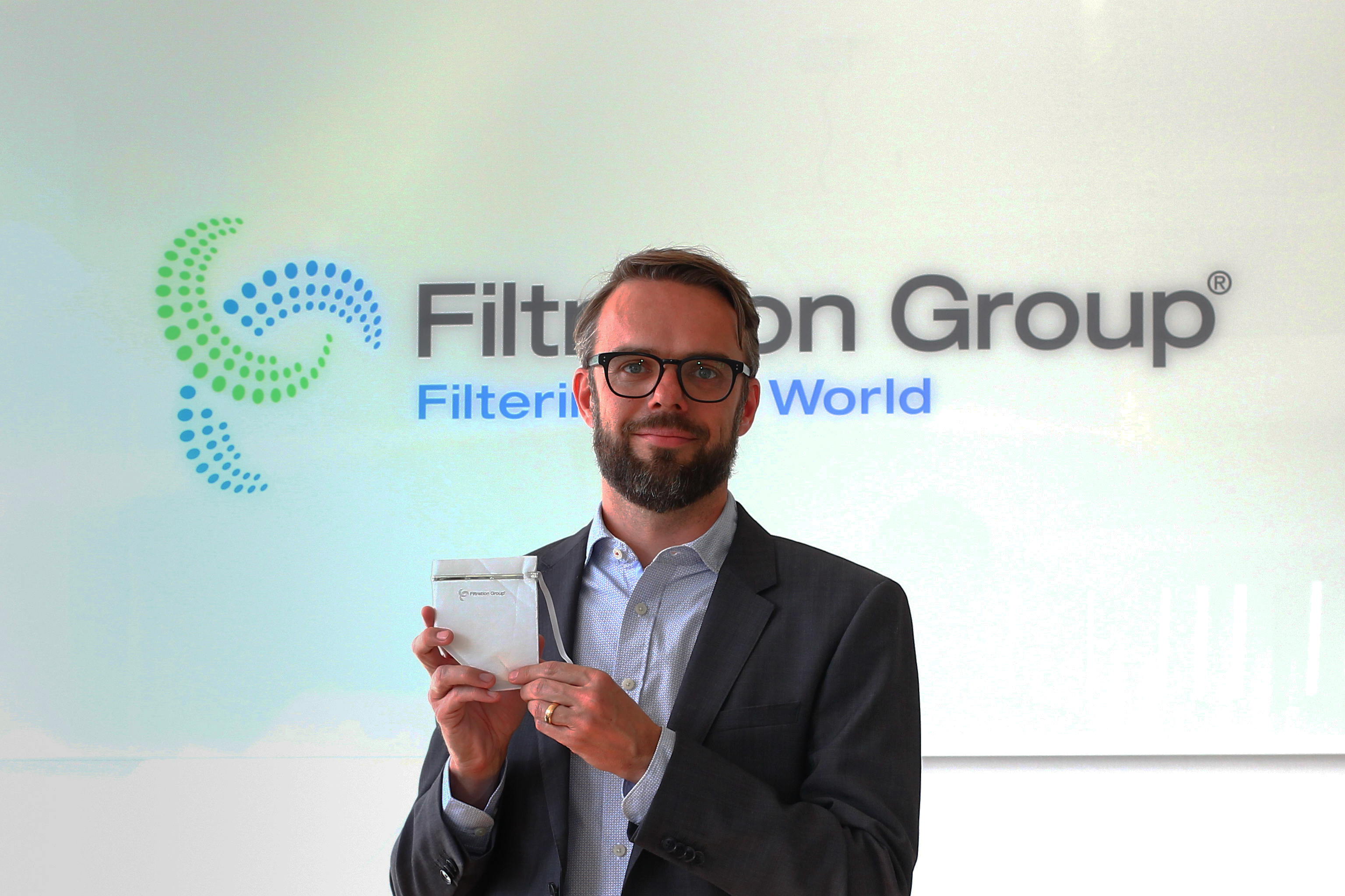 Gunnar Halden, president of Filtration Group Industrial, with a prototype of the face mask. Image copyright Filtration Group GmbH.