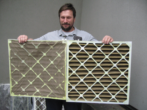A  Mycelx  employee examining the company's air filters and target membranes.