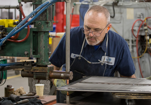 Filtration leaf being rescreened in precision-fit frame at Cambridge Engineered Solutions plant in Cambridge, Maryland.