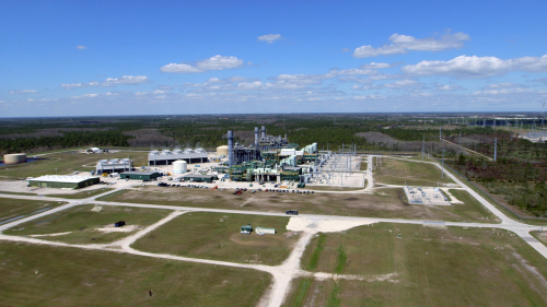 The Curtis H. Stanton Energy Center at the power plant, left Orlando Utilities Commission (OUC).