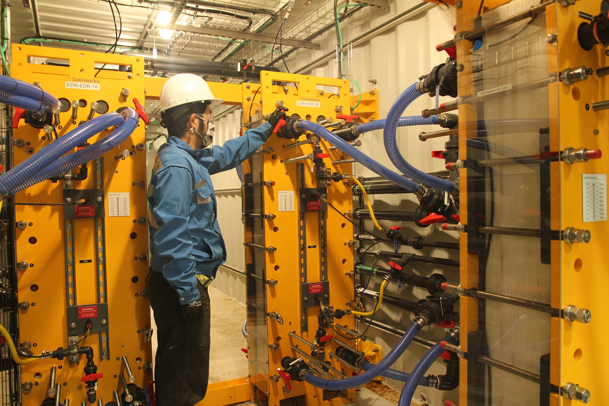 A Saltworks engineer inspects one of the plant’s FlexEDR stacks.